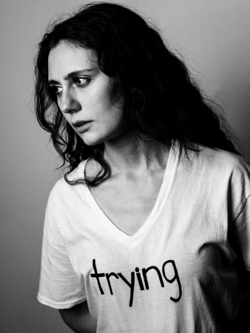 lizzie is trying wearing 'trying' shirt